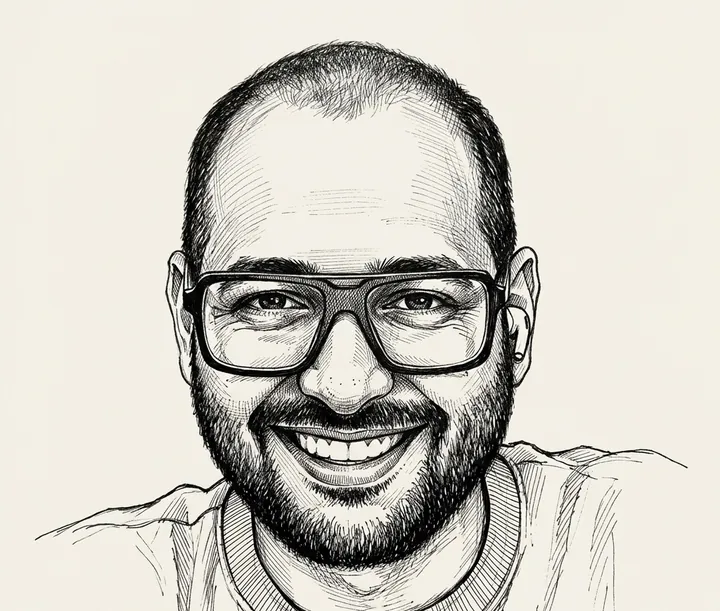 Ink drawing of Himanshu, smiling, with glasses and a beard